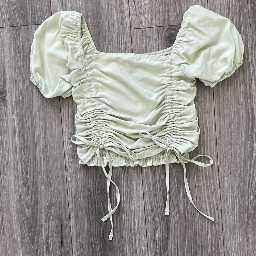 Green ruffled back, tie top